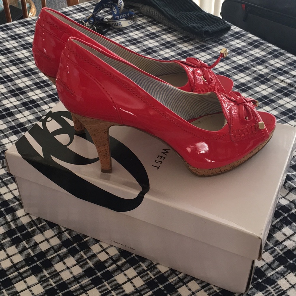 Nine West red patent pumps